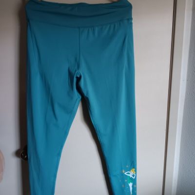 Disney Tinker Bell leggings with 2 side pockets, size L in teal, graphic on leg.